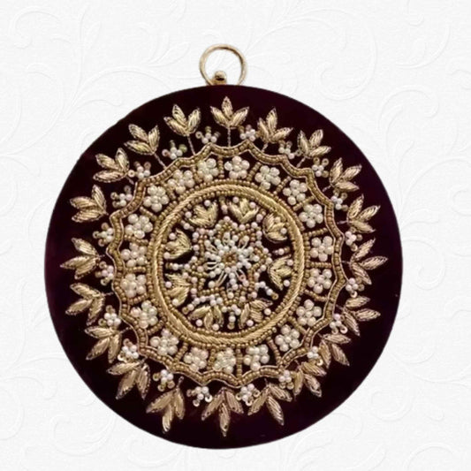 Maroon velvet round clutch with golden floral embroidery and ring handle – Anam Clutches
