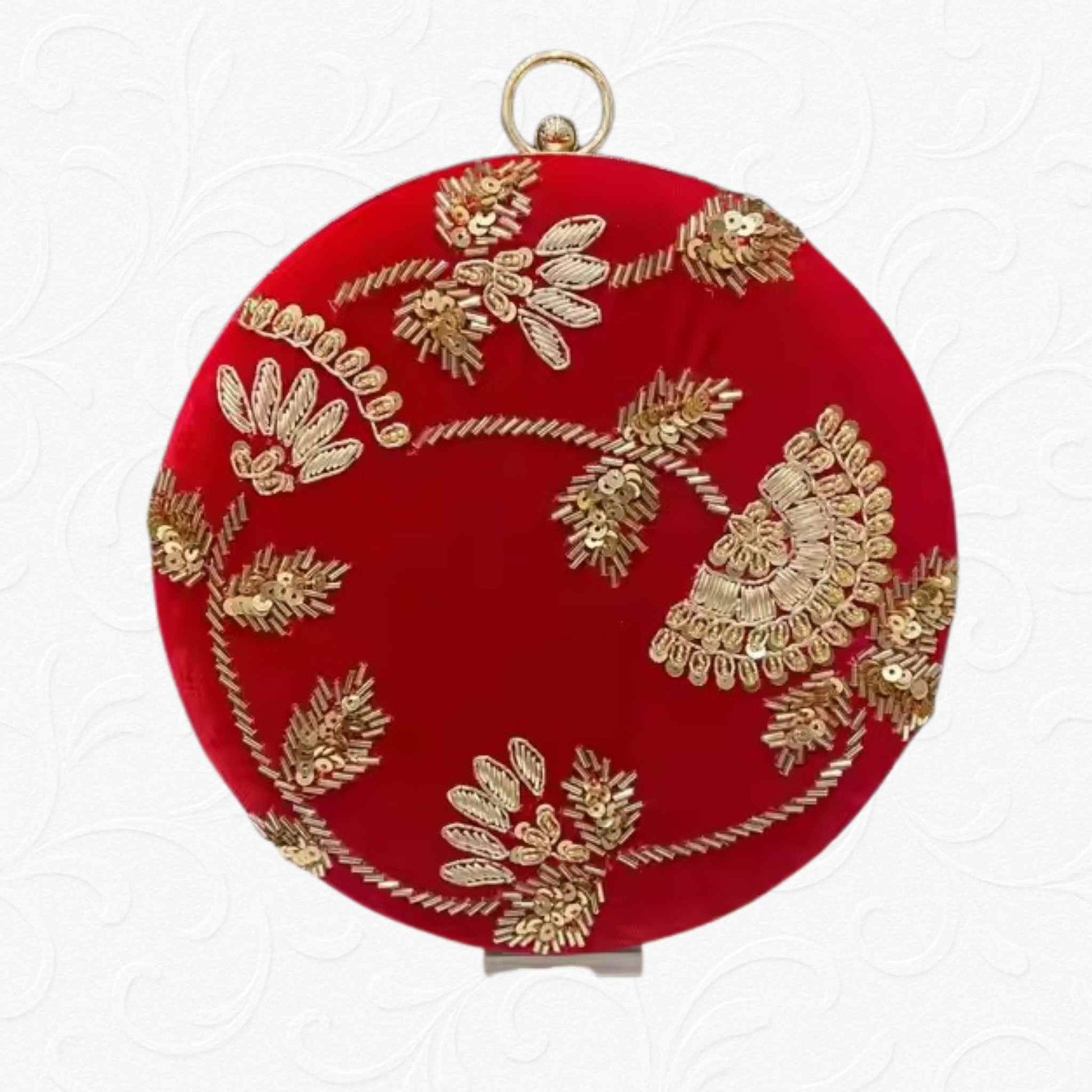 Red velvet round clutch with golden floral embroidery and metallic ring handle – Anam Clutches
