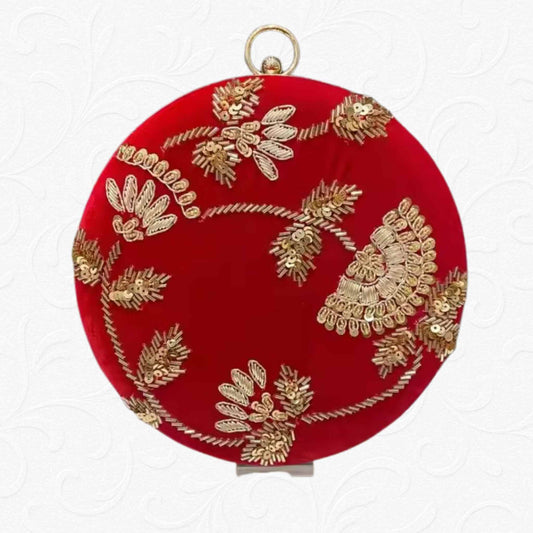 Red velvet round clutch with golden floral embroidery and metallic ring handle – Anam Clutches

